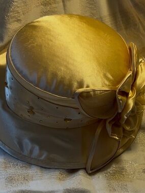Elegant Gold Satin Women's Dress Hat with Floral Accent